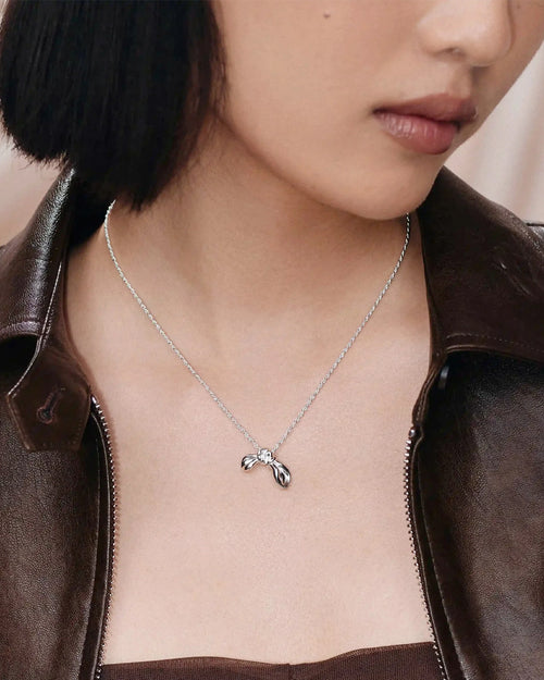 MARK GONG BOW PENDANT NECKLACE / SILVER