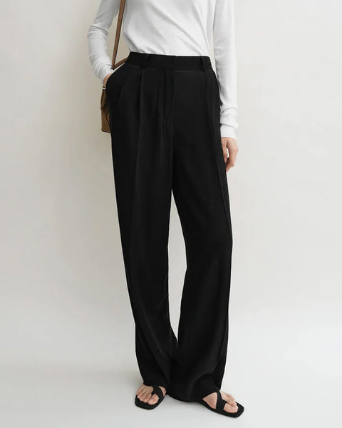 +(Plūs) Wide two-pleat trousers black TONYWACK: Black Wool Double-Pleated Wide Trousers | SSENSE